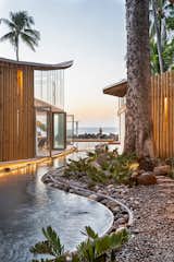 Exterior, Stucco Siding Material, Tile Roof Material, Curved RoofLine, Glass Siding Material, Wood Siding Material, and Beach House Building Type  Photo 15 of 16 in Al Suave House by Cincopatasalgato