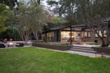 Lafayette Mid Century Modern Remodel
The owners of this property had been away from the Bay Area for many years, and looked forward to returning to an elegant mid-century modern house. The one they bought was anything but that. Faced with a “remuddled” kitchen from one decade, a haphazard bedroom / family room addition from another, and an otherwise disjointed and generally run-down mid-century modern house, the owners asked Klopf Architecture and Envision Landscape Studio to re-imagine this house and property as a unified, flowing, sophisticated, warm, modern indoor / outdoor living space for a family of five.
Opening up the spaces internally and from inside to out was the first order of business. The formerly disjointed eat-in kitchen with 7 foot high ceilings were opened up to the living room, re-oriented, and replaced with a spacious cook's kitchen complete with a row of skylights bringing light into the space. Adjacent the living room wall was completely opened up with La Cantina folding door system, connecting the interior living space to a new wood deck that acts as a continuation of the wood floor. People can flow from kitchen to the living / dining room and the deck seamlessly, making the main entertainment space feel at once unified and complete, and at the same time open and limitless.
Klopf opened up the bedroom with a large sliding panel, and turned what was once a large walk-in closet into an office area, again with a large sliding panel. The master bathroom has high windows all along one wall to bring in light, and a large wet room area for the shower and tub. The dark, solid roof structure over the patio was replaced with an open trellis that allows plenty of light, brightening the new deck area as well as the interior of the house. Located in Lafayette, CA this remodeled single-family house is 3,363 square foot, 4 bedroom, and 3.5 bathroom.