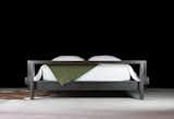our industrial modern bed: the frame is darkened to its dark grey/blue color, then oiled and waxed to remove moisture and control patina. the platform consists of a hand-selected blend of renewable pine, douglas fir, and cedar. the wood is sandblasted to reveal the texture of the woodgrain, aged using a natural vinegar-based wash, and then sealed with a floor-grade oil finish for longterm protection.