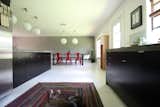 The original dining table from seventeen20. Bistro chairs from Industry West, clock from CB2, rug by Capel.
