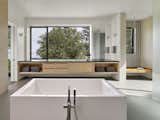 Maple cabinets, espresso counters and blue-gray tiles bring nature's palette inside.