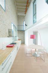 Kitchen, Wood Counter, Ceramic Tile Floor, and White Cabinet  Photo 9 of 29 in Inside House by Habitan Architects