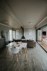 Dining, Chair, Table, Wood Burning, Ceiling, and Dark Hardwood  Dining Ceiling Chair Dark Hardwood Wood Burning Photos from Take in the South African Countryside in This Shipping Container Eco-Cabin