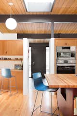 The front door leads straight into the kitchen, a central gathering place. 