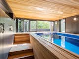 "The property does not have a conventional backyard, so the pool is a place where the adults can get some exercise, and the two young children can play. From here, the evening sun streams through the slide-fold doors, creating a lovely ambiance," Schaer explains.

