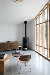 A wood-burning fireplace in Stable Conversion creates a sense of home. The project by SHED Architecture + Design is full of light and intended as a flexible space for guests, a home office, or a creative space.