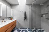 Bath Room, Undermount Sink, Marble Counter, Ceramic Tile Floor, Enclosed Shower, Concrete Wall, and Corner Shower  Photos from Irwin Caplan Midcentury