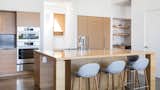 Kitchen, Concrete Floor, Wood Cabinet, Recessed Lighting, Engineered Quartz Counter, Undermount Sink, and Refrigerator  Photos from Folsom