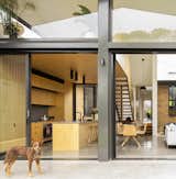 Windows, Metal, Picture Window Type, and Sliding Window Type A binary play of considered honey and gray tones strongly reference the exterior yellow brick and gray metal of the two distinct structures.  Photos from Binary House