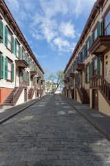 The twenty landmarked Victorian row houses flank a cobblestone street to the Morris Jumel Mansion, where George Washington stayed during the Revolutionary War.