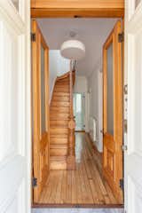 Original entry doors, pine floors and staircase restored throughout.  Chandelier by Flos.