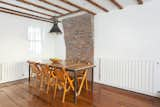 Kitchen dining area. Antique outdoor chandelier salvaged from a wharf in New England. Radiators by Baxi.