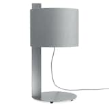 Blu Dot Note Table Lamp

A slender yet substantial steel spine allows a linen shade to hover above a round steel cantilevered base.
