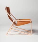 BLU DOT TORO LOUNGE CHAIR You will be hanging in style in the thick, saddle-leather sling of this modern lounge chair. It’s comfortable and marvelous to look at all at once. No bull. Shown in day.