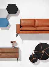 Hecks Ottoman | New Standard Leather Sofa | Clad Credenza | Punk Lamp | Pi Tables