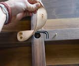 The single tool required for assembly is contained beneath a leather flap under the table.&nbsp;