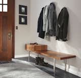 A beautiful bench with built-in storage can take care of most of your needs, from organizing gloves and sunglasses to providing a place to put on shoes before heading out.
