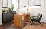Featuring a solid wood frame with elegant angles and a loose back cushion, the Sanna leather chair evokes a mid-century feel. #furniture #office #madeinamerica