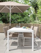 Our Carmel outdoor dining chair combines the comfort of a fully upholstered chair with outdoor performance. A strong powder-coated stainless steel base supports a seat made from quick-drying foam and trusted Sunbrella® fabric. Spills, sun and water are no match for this winning combination of outdoor materials. #furniture #outdoor #madeinamerica   Photo 1 of 83 in Modern Outdoor Furniture by Room & Board