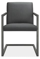 A contemporary twist on traditional dining chairs, the Lira chair is scaled for easy livability. An inviting seat seems to float in a steel frame. The arms fit underneath any of our tables so the chairs take up minimal space. #furniture #dining #madeinamerica   Photo 15 of 30 in Modern Dining Chairs by Room & Board