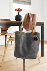 This American-made tote mixes a water-repellent waxed canvas body with rich domestic leather straps. 
