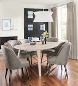 Dining Room, Table, Chair, and Pendant Lighting Durable hardwood is transformed into the fluid profile of our Lowell round extension table, all through the skill of West Virginia woodworkers.   Search “west virginia” from Modern Dining Furniture