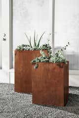 Give your plants a unique home with modern planters made from COR-TEN steel. Often used for bridges or outdoor sculptures, this weathering steel forms a stable, rust-like patina when exposed to the elements. When you receive the planter, it has a shiny appearance that develops a protective layer over time, revealing shades of orange, brown and black. It’s a one-of-a-kind, industrial look that adds interest to your outdoor spaces.