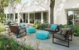 Montego sofa with cushions, Montego lounge chair with cushions, Boyd round ottoman, solid outdoor pillows