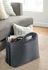 Store magazines and more in this sturdy felt tote. Leather laces and handles create a sophisticated mix of materials. The tote stands upright so you can easily place it next to your sofa or under your desk.
