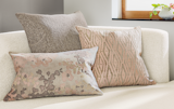 Hand-block printed in Philadelphia, a field of flowers in muted tones is scattered across the Fleur throw pillow. 