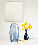 Crafted exclusively for us by Hennepin Made, Grace is hand-blown by a glass artist in their northeast Minneapolis studio. A diffuser on top of the crisp cotton shade gives a soft glow.
