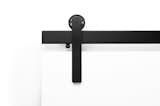 The Ragnar sliding door hardware system in Black Stainless finish and Face Mount.
