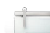 The Ragnar sliding door hardware system in Brushed Stainless finish and Glass Mount.