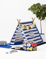The collection includes a Play Tent, seen here in a Lokki print, along with accessories like pillows, poufs, towels, and a memory card game. 