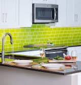 Lush 3x6 glass subway tile in Lemongrass bright green.