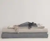 AREA Inc. ELLIOT dark grey. Similar to BRICK, dark grey and neutral white are woven for a salt and pepper effect. 100% baby alpaca throws and blankets.