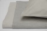 AREA Inc. JEWEL grey, a cotton sateen in clean pale grey, reversible to a more classic grey flannel shade in the duvet and flat sheet--fitted sheet and pillowcases are in the lighter color only. Versatile, soothing, sleepy tones - unique Area design.