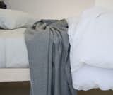AREA Inc. ELLIOT dark grey. Dark grey and neutral white yarns for a salt and pepper effect. 100% baby alpaca throws and blankets.
