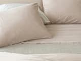 AREA Inc. PERLA powder, a perfect mix of peach and pink, a romantic shade that works for most interiors, especially with greys and browns. This extra-fine cotton sateen has been dyed and washed for a lived-in, relaxed style, and is very, very soft - what you see is what you get, even after you've washed it again.