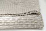 AREA Inc. THEO multi, a soft, mid-weight, 100% cotton blanket and throw. The mix of colors, small chain-link pattern and knitted texture makes for a unique and functional blanket bringing comfort to you and your home.