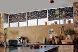 Roller Shades shown in material Spanish Wildflower, color Brown.