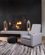 Modern upholstered Grano glider recliner in pebble grey by Monte Design with a Missoni fabric pillow