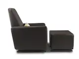 Modern upholstered Grano glider recliner and ottoman in brown bonded leather by Monte Design with a tan pillow