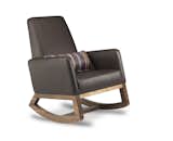 Modern upholstered Joya rocker in brown bonded leather body with walnut base by Monte Design with a Paul Smith pillow