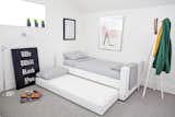 Modern upholstered Dorma twin bed in white body with white piping and trundle bed by Monte Design 