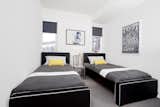 Modern upholstered Dorma twin beds in black body with white piping by Monte Design 