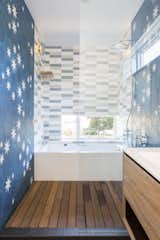 Bath Room, Medium Hardwood Floor, Open Shower, Drop In Sink, Quartzite Counter, Ceramic Tile Wall, Drop In Tub, Soaking Tub, and Wall Lighting  Photo 5 of 5 in Ashworth Residence by CAST architecture