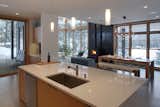 Kitchen, Wood Cabinet, Concrete Floor, Pendant Lighting, Ceiling Lighting, and Undermount Sink  Photo 5 of 8 in Nelson Cabin by CAST architecture