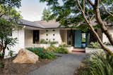 Exterior, House Building Type, Wood Siding Material, and Brick Siding Material Entry, courtyard, and entrance to ADU on left  Photo 13 of 14 in Windermere Midcentury Renovation +ADU by CAST architecture