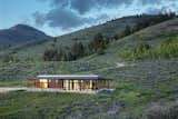 The off-grid cabin, nestled in the hills on a 5+ acre site bordering U.S. Forest Service land